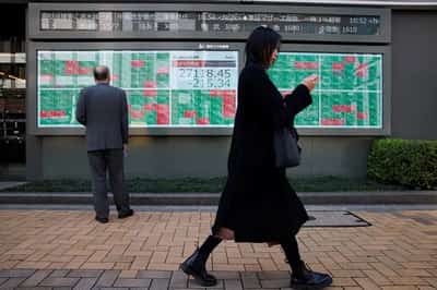 Image for Asian shares slip, yen aims for best week in 4 months on BOJ hike bets