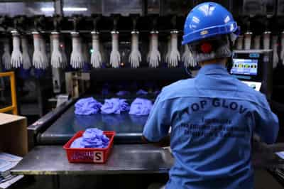 Image for Malaysia&#8217;s Top Glove charged with providing uncertified worker accommodation: state news agency