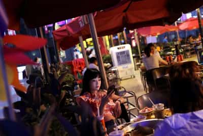 Image for From hiking to hotpot, lonely consumers in China fuel a $74 billion companionship economy