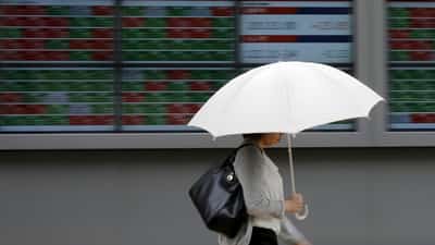 Image for Shares advance, oil prices settle sharply lower as markets shrug off Iran conflict
