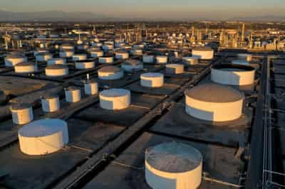Image for Oil prices rise as China eases COVID curbs, U.S. storm fuels supply worries