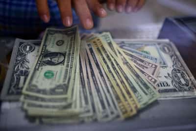 Image for Dollar falls after soft consumer confidence as economic concerns drag