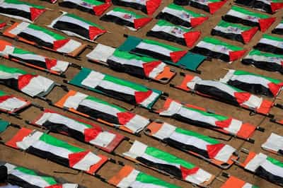 Image for Gazans bury nearly a whole clan found in rubble in mass funeral for 112