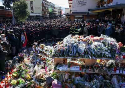 Image for Grieving Swiss town holds silent procession for victims of deadly bar fire