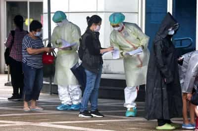Image for Taiwan kept COVID below 15,000 cases for all 2021. Now it has 80,000 a day, testing its ‘new model’
