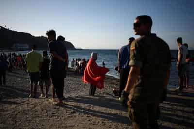 Image for Spain's Ceuta overwhelmed as thousands remain after migrant border rush