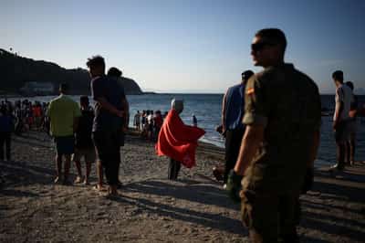 Image for Spain's Ceuta overwhelmed as thousands remain after migrant border rush
