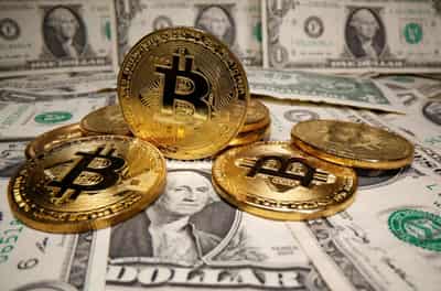 Image for Dollar held down by doubts over pace of U.S. recovery; bitcoin retreats from record high