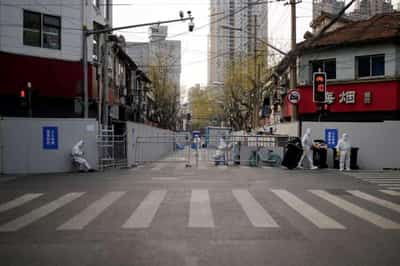 Image for Shanghai expands COVID lockdown as new daily cases surge by a third