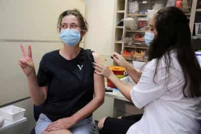 Image for Israel&#8217;s COVID-19 vaccine boosters show signs of taming Delta
