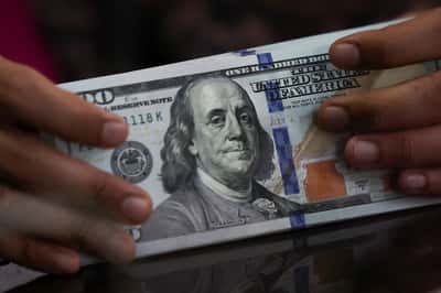 Image for Dollar wobbles as investors balk at US Treasury's rescue efforts