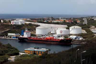 Image for Oil settles up near $75; sharp U.S. inventory drop counters virus worry