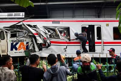 Image for Indonesia train crash toll rises to 14 as rescuers work to remove trapped passengers