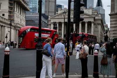 Image for From Tokyo to London, heatwaves send men to work in shorts