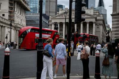 Image for From Tokyo to London, heatwaves send men to work in shorts