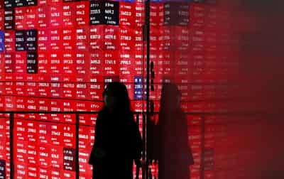 Image for U.S. stocks close below record highs, world indexes set for double-digit 2025 gains