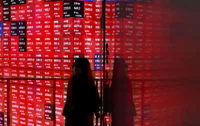 Image for World shares edge higher, US yields drop ahead of Fed