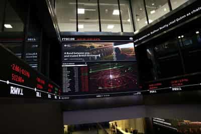 Image for London's FTSE 100 edges lower as utilities and miners weigh