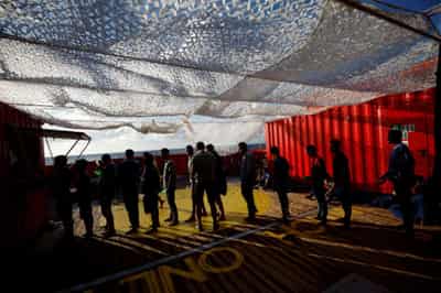 Image for After rescue by Open Arms, 99 migrants wait to dock in Europe