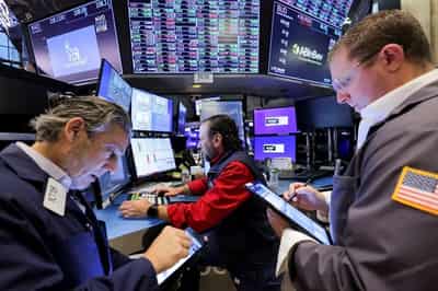 Image for Stocks rise, oil settles slightly up as Russia-US tensions mount