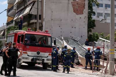 Image for Four trapped after residential building collapses in Athens, fire brigade says