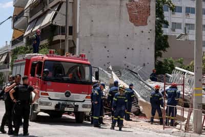 Image for Four trapped after residential building collapses in Athens, fire brigade says