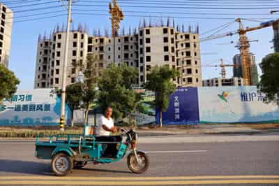 Image for China&#8217;s mom-and-pop investors, builders and homebuyers caught in Evergrande debt crisis