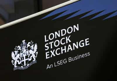 Image for UK shares extend rally as oil slides; corporate gains lift midcaps