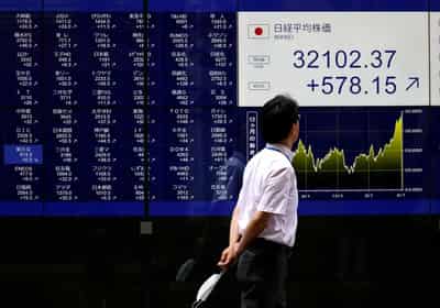 Image for World stocks rise on rate cut bets, yen flounders at 38-year lows