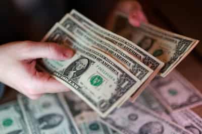 Image for Dollar firms as oil climbs, bond rout saps risk appetite