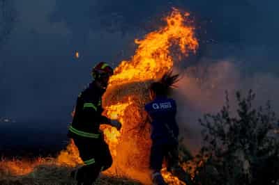 Image for Spanish and French firefighters feel the strain from tackling huge blazes