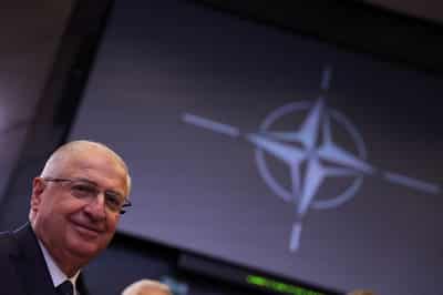 Image for Exclusive-Turkey backing Syria's military and has no immediate withdrawal plans, defence minister says