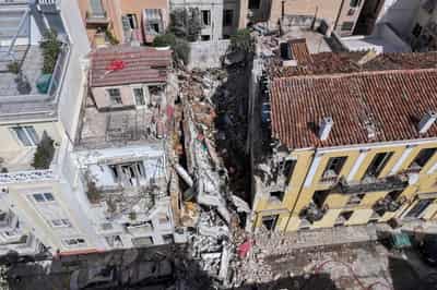 Image for One dead, 5 missing after explosion destroys building in Athens