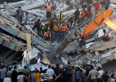 Image for War-damaged Gaza building collapses killing 12 people seeking shelter inside