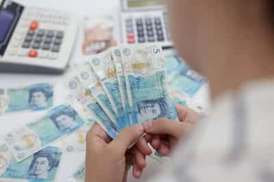 Image for Dollar pauses for breath as fragile pound edges up