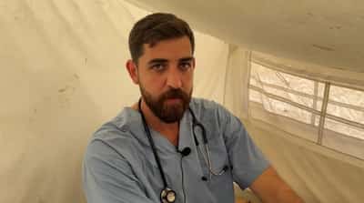Image for Displaced Gaza doctor offers free medical help for children from his tent
