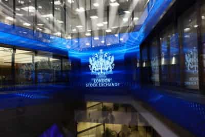 Image for London stocks fall after Trump issues tariff threat; Beazley hits record high