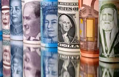 Image for Dollar dips, Aussie gains on improving risk sentiment