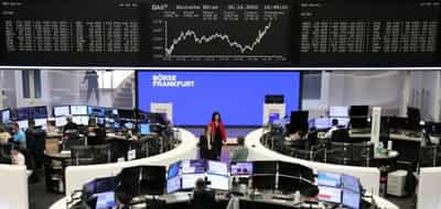 Image for European stocks cut losses as ECB hikes rate as expected