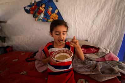Image for How two families crossed the rubble of Gaza, fleeing war and hunger