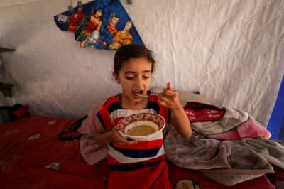 Image for How two families crossed the rubble of Gaza, fleeing war and hunger