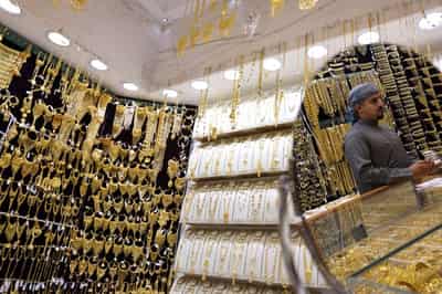 Image for Gold races to $5,100 record peak on frantic safe-haven demand