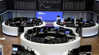 Image for European shares hover near record highs; commodity stocks weigh