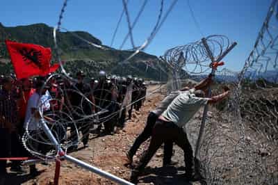 Image for Protesters tear down Albanian development site fences, amid anger over coastal projects
