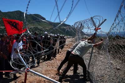 Image for Protesters tear down Albanian development site fences, amid anger over coastal projects