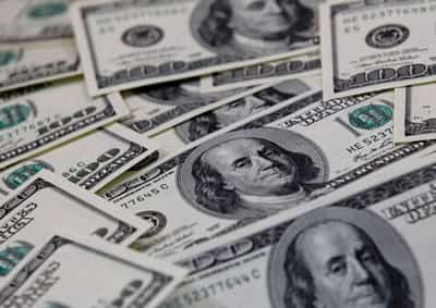 Image for Dollar pinned as Powell plods toward tapering