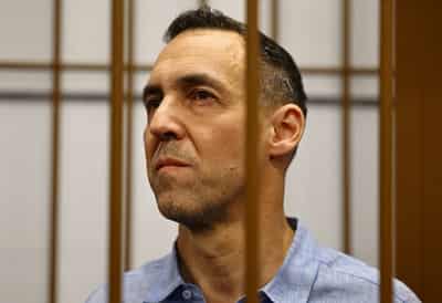 Image for Putin promises to look into case of jailed Frenchman Laurent Vinatier
