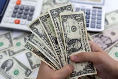 Image for Dollar edges up as stocks rally, inflation data eyed