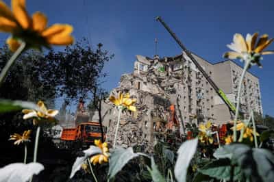 Image for Ukrainian rescuers clear rubble as Kyiv mourns 30 killed in Russian attack