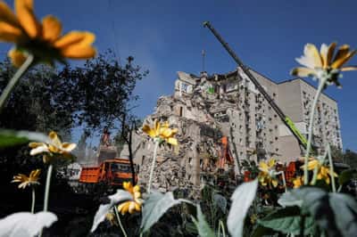 Image for Ukrainian rescuers clear rubble as Kyiv mourns 30 killed in Russian attack